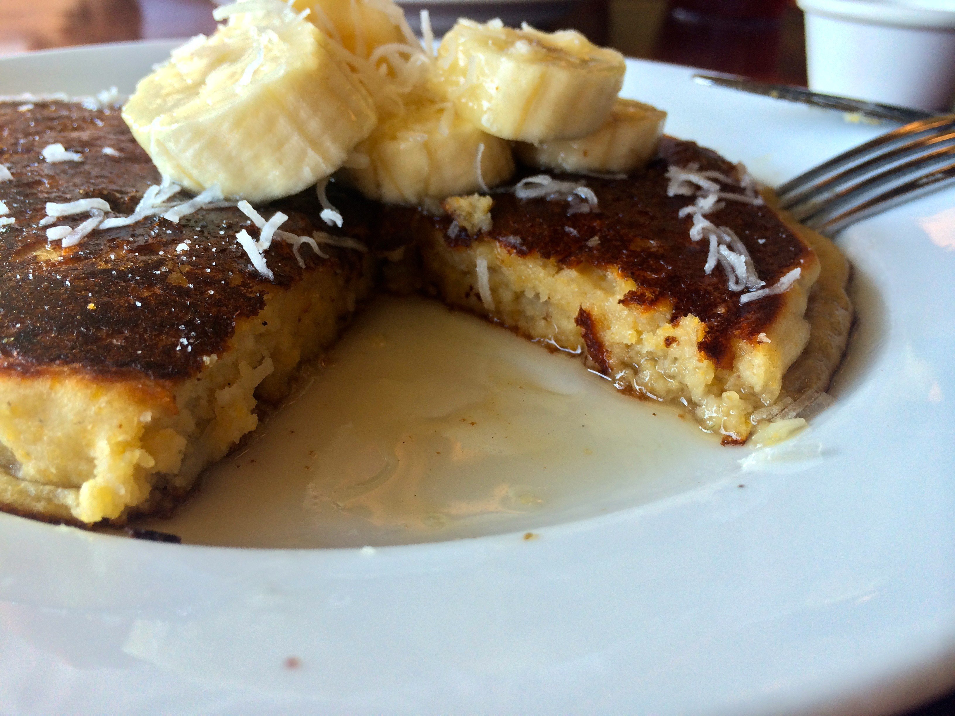 Hugo's pineapple and coconut pancake with bananas and coconut cane syrup.; Credit: B. Douglas