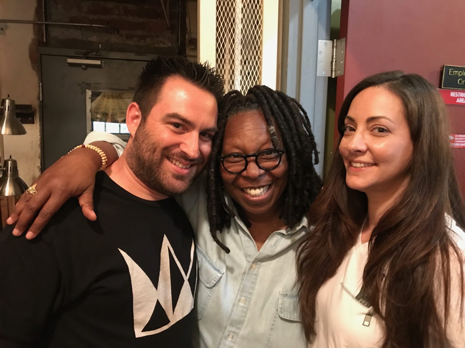 Jason Beck and Dina Browner of AHHS pose with Whoopi Goldberg