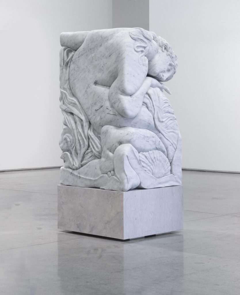 The Hole Adam Parker Smith Venus Rising From the Waves 2022 White Carrara marble on travertine pedestal. 55 x 33.5 x 32.5 in. Courtesy of Fabien Fryns Fine Art