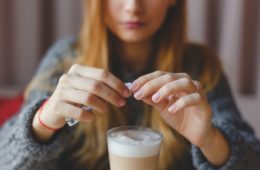 putting sugar in coffee scaled e1662853088156