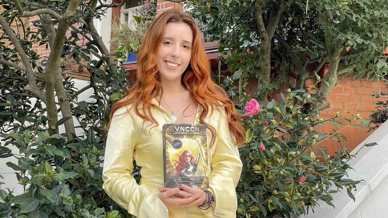 A Message to the Moon: Samantha Tauber’s VNCCII Project 37 large Samantha Tauber press photo with book 1 1